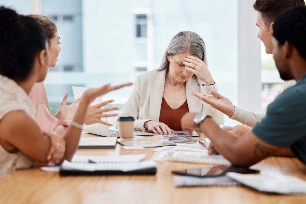 elderly employee being reprimanded